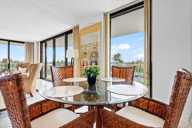 3400 S Ocean Blvd Unit 2Aii, Palm Beach, FL 33480 - dining area featuring a wall of windows and a textured ceiling