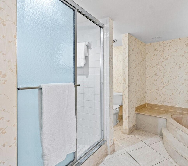 bathroom featuring walk in shower, tile patterned flooring, and toilet