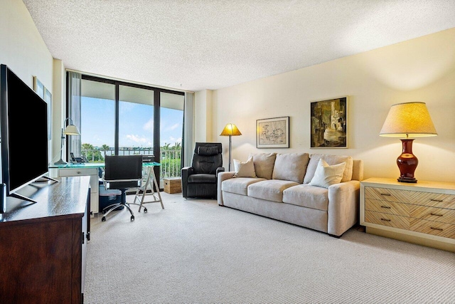 3400 S Ocean Blvd Unit 2Aii, Palm Beach, FL 33480 - living area with carpet flooring, expansive windows, an office area, and a textured ceiling