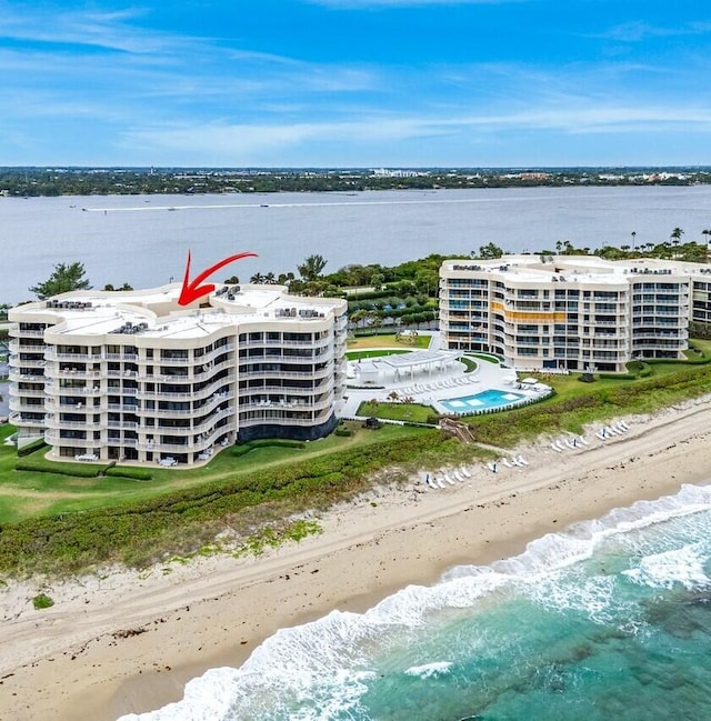 aerial view with a water view and a view of the beach