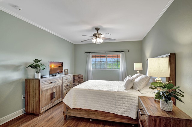 bedroom featuring crown molding, ceiling fan, and hardwood / wood-style floors