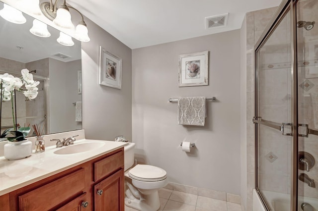 full bathroom featuring tile patterned flooring, vanity, bath / shower combo with glass door, and toilet