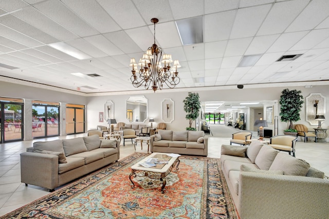 tiled living room with an inviting chandelier and a paneled ceiling