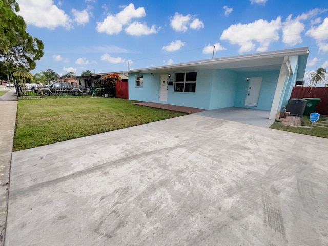 ranch-style home with a front yard