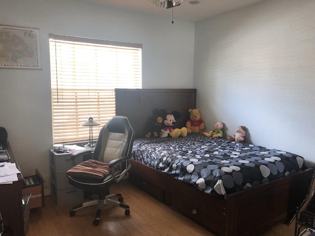 bedroom with hardwood / wood-style flooring