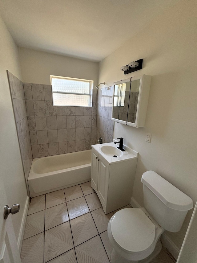 full bath featuring tile patterned flooring, vanity, baseboards, toilet, and bathing tub / shower combination