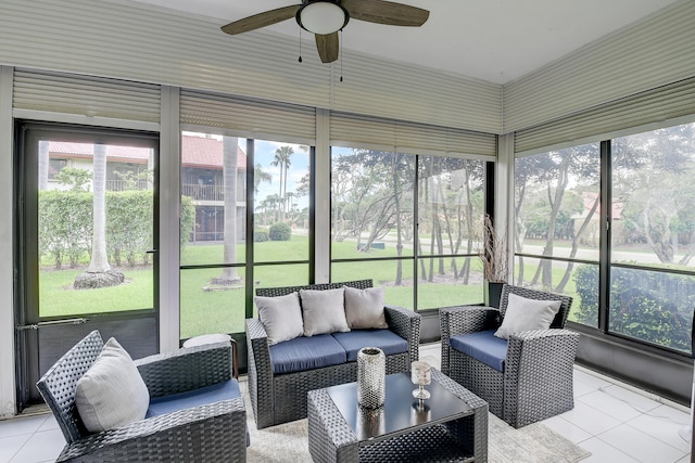 sunroom featuring ceiling fan