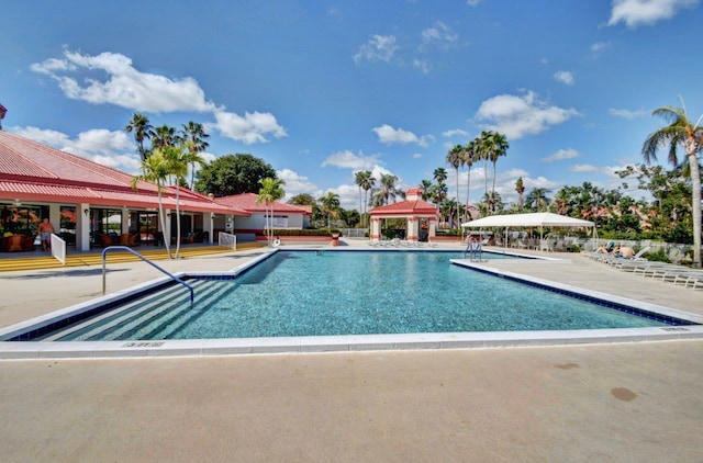 view of swimming pool featuring a gazebo and a patio area