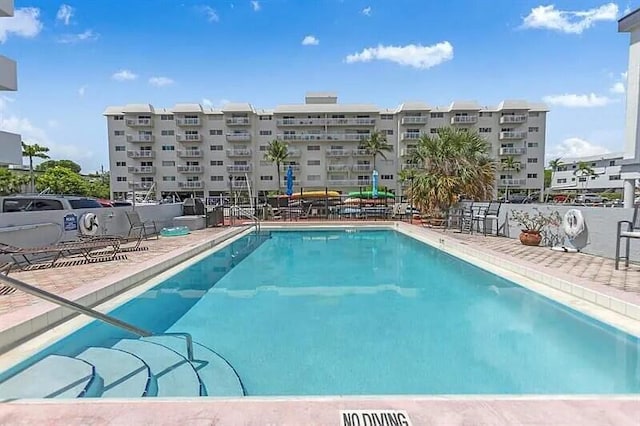 view of swimming pool with a patio area