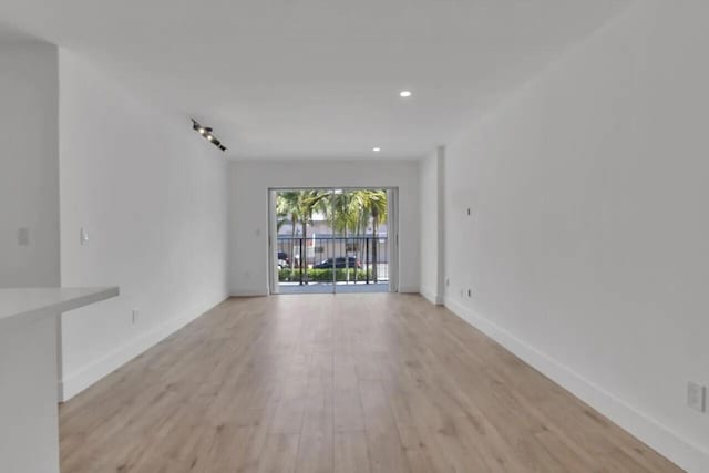 unfurnished living room featuring light hardwood / wood-style floors