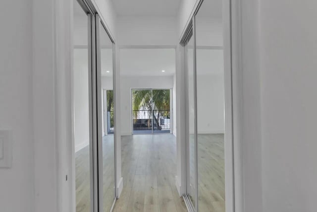 corridor with light wood-type flooring