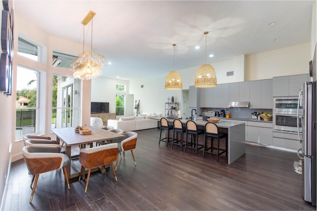 dining room featuring dark hardwood / wood-style flooring and sink