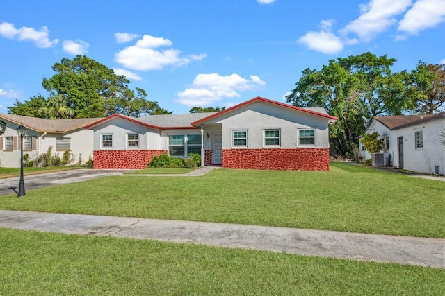 ranch-style home featuring central AC and a front lawn