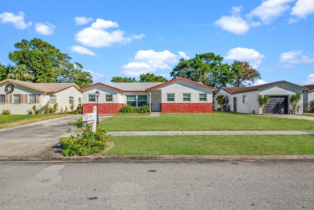 single story home featuring a garage and a front lawn