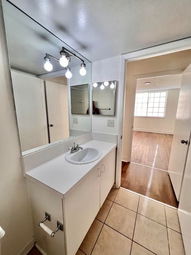 bathroom with vanity and hardwood / wood-style flooring