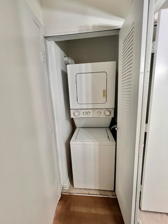 washroom with stacked washer / drying machine