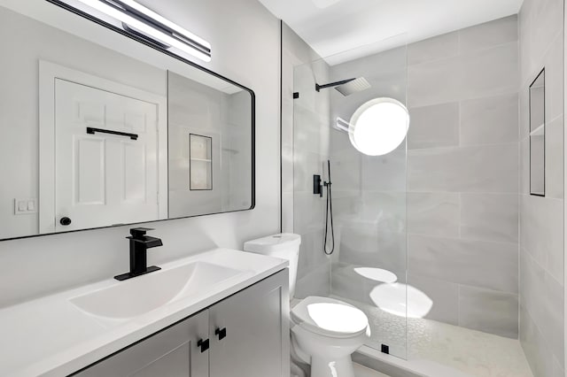 bathroom with vanity, toilet, and walk in shower