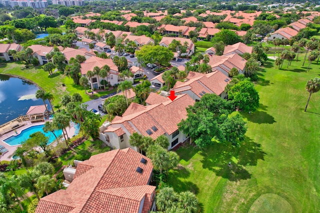 birds eye view of property featuring a residential view and a water view