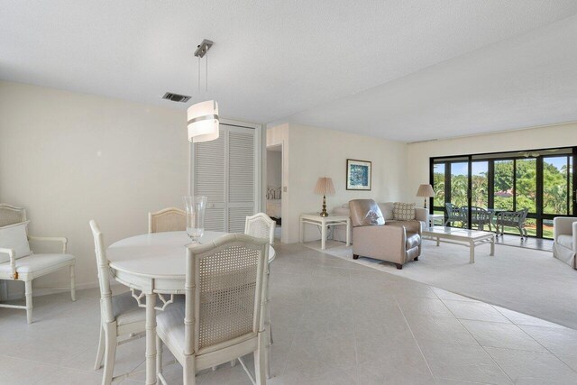 dining room with a textured ceiling