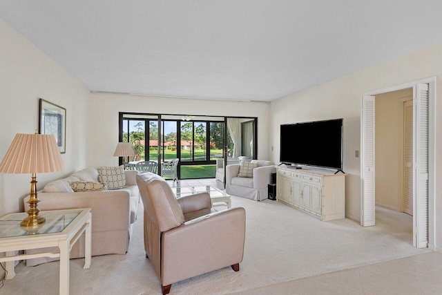 living room featuring light carpet