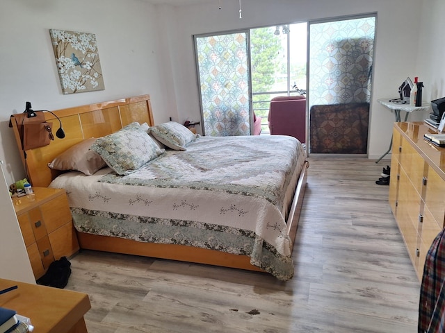 bedroom with light hardwood / wood-style flooring