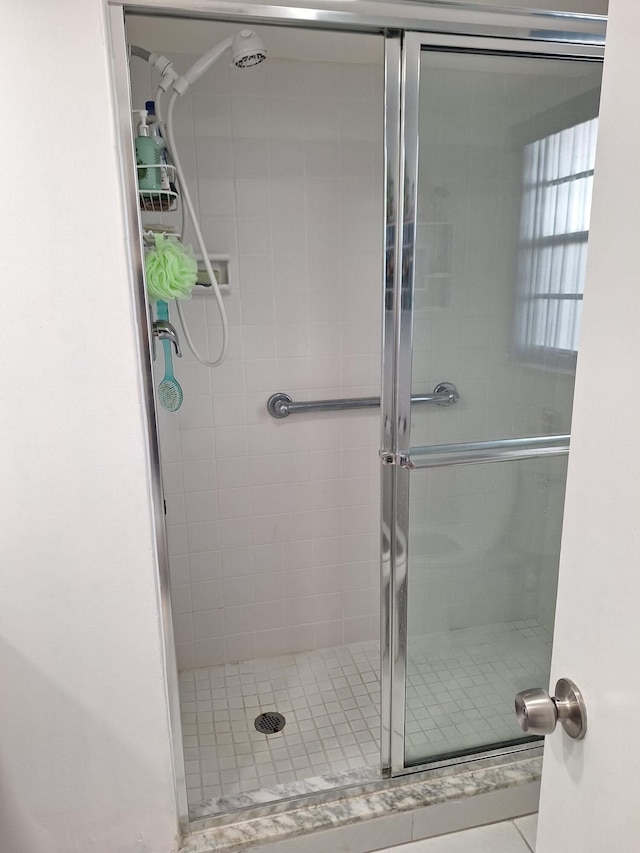 bathroom featuring walk in shower