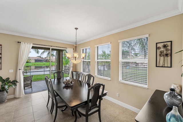 dining area with a water view, crown molding, light tile patterned floors, and a notable chandelier