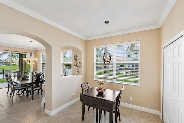 dining space featuring ornamental molding, light tile patterned floors, a wealth of natural light, and a notable chandelier