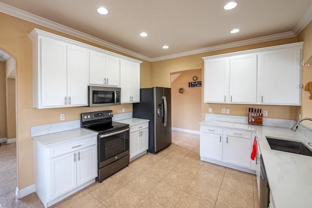 kitchen featuring crown molding, white cabinetry, sink, and appliances with stainless steel finishes