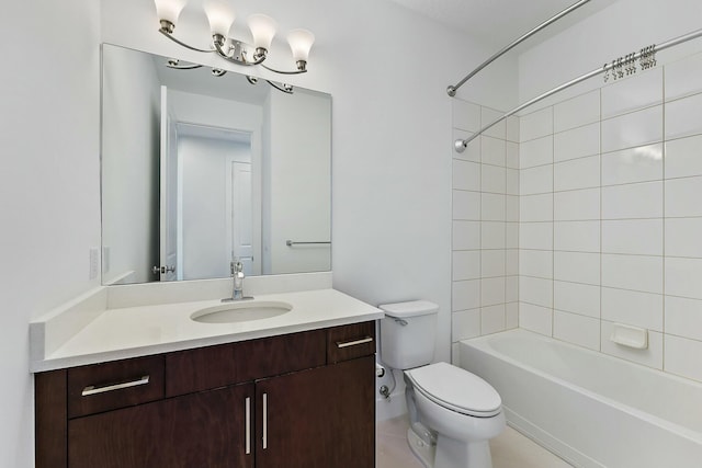 full bathroom with toilet, vanity, and tiled shower / bath