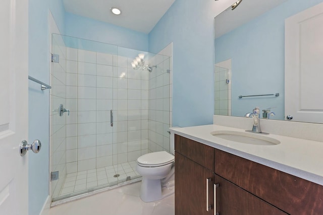 bathroom with tile patterned floors, vanity, toilet, and a shower with shower door