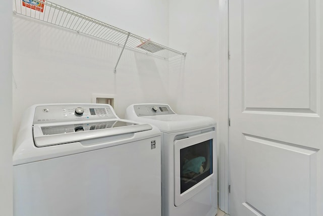 laundry room with washer and dryer