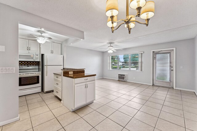 kitchen featuring white appliances, backsplash, white cabinetry, and sink