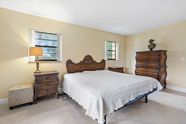 bedroom featuring light tile patterned flooring