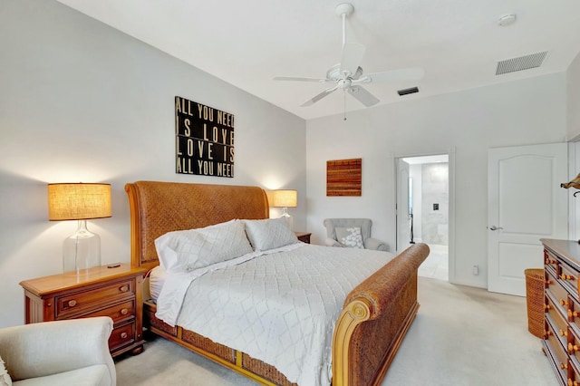 bedroom with connected bathroom, ceiling fan, and light colored carpet