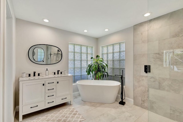 bathroom featuring separate shower and tub, tile patterned floors, and vanity