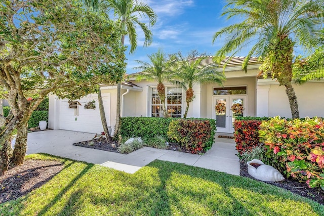 view of front of house featuring french doors and a garage