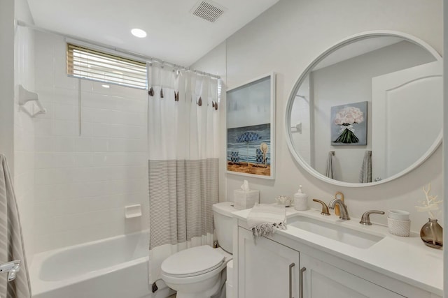 full bathroom featuring vanity, shower / bath combo, and toilet