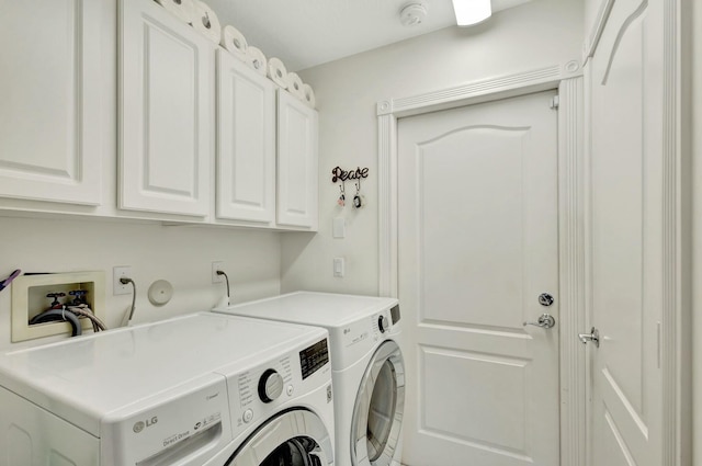 laundry room with cabinets and separate washer and dryer