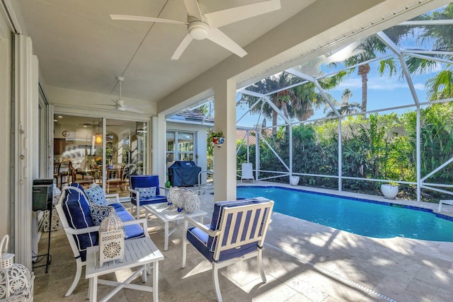 view of pool featuring a lanai, ceiling fan, and a patio