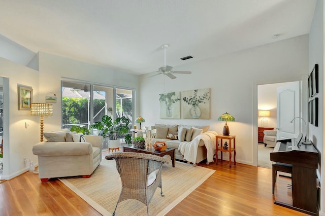 living room featuring light wood-type flooring and ceiling fan