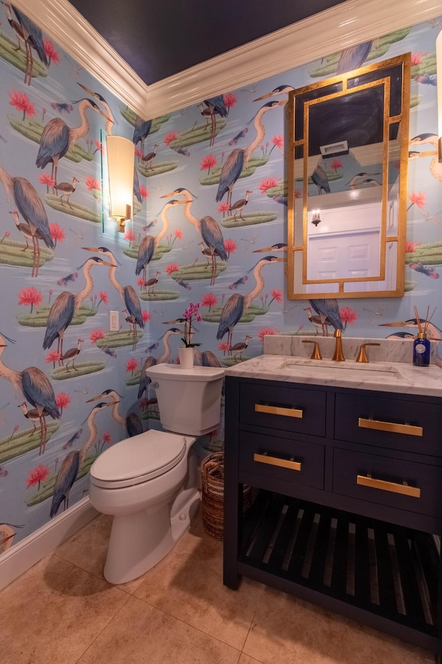 bathroom featuring tile patterned floors, vanity, toilet, and ornamental molding