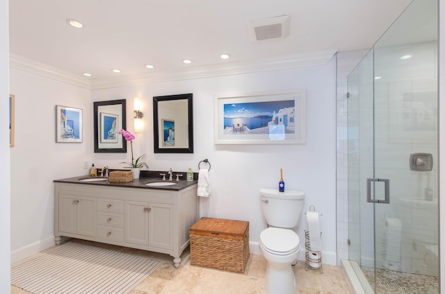 bathroom with vanity, toilet, ornamental molding, and a shower with door