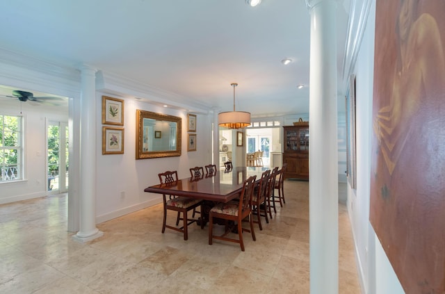 dining room with ceiling fan, ornate columns, and crown molding