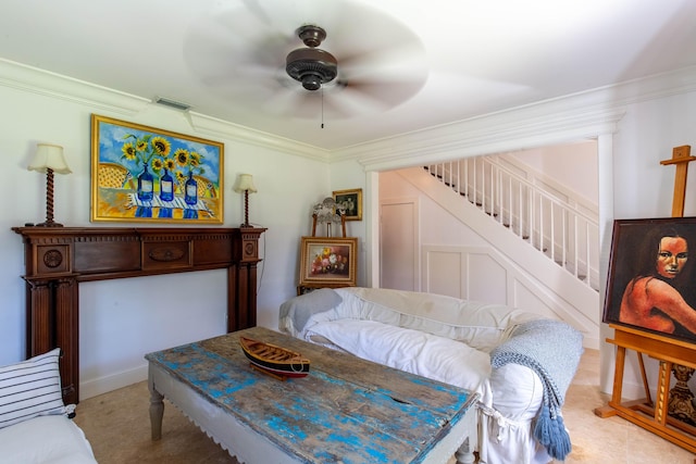 bedroom with ceiling fan and ornamental molding