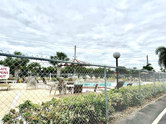 community pool featuring fence