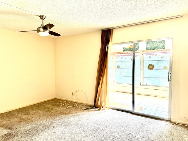 empty room with carpet, a textured ceiling, and ceiling fan