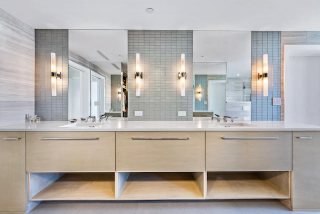 bathroom featuring vanity, tile walls, and walk in shower