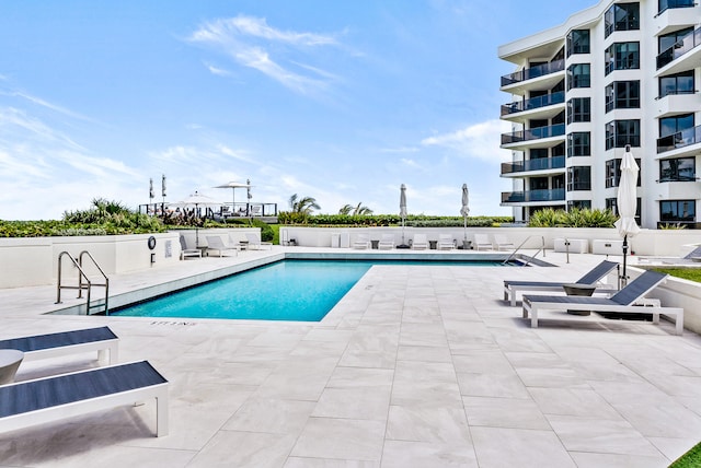 view of swimming pool featuring a patio