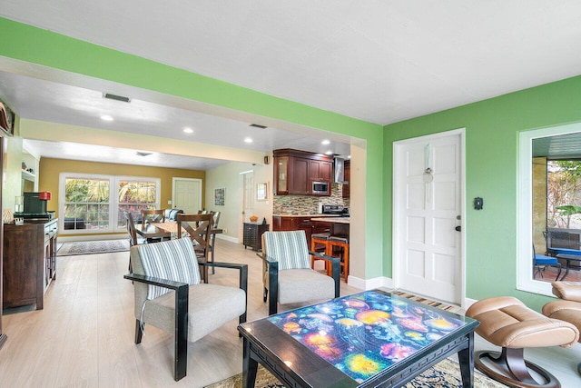 dining area with light hardwood / wood-style floors